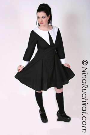 black long sleeve dress with white collar and cuffs